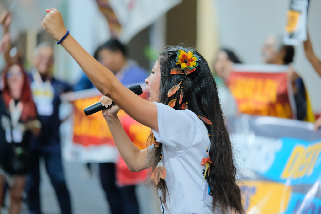 Demonstrators protest during the “End of the World Market” action at COP30 in Belém, Brazil.